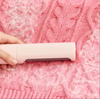 Reusable pet hair remover demonstrated on knit fabric