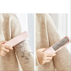 Pet hair remover lifting loose fur from clothing