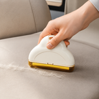 Cream Furvelis compact washable pet hair remover collecting loose fur from a car seat